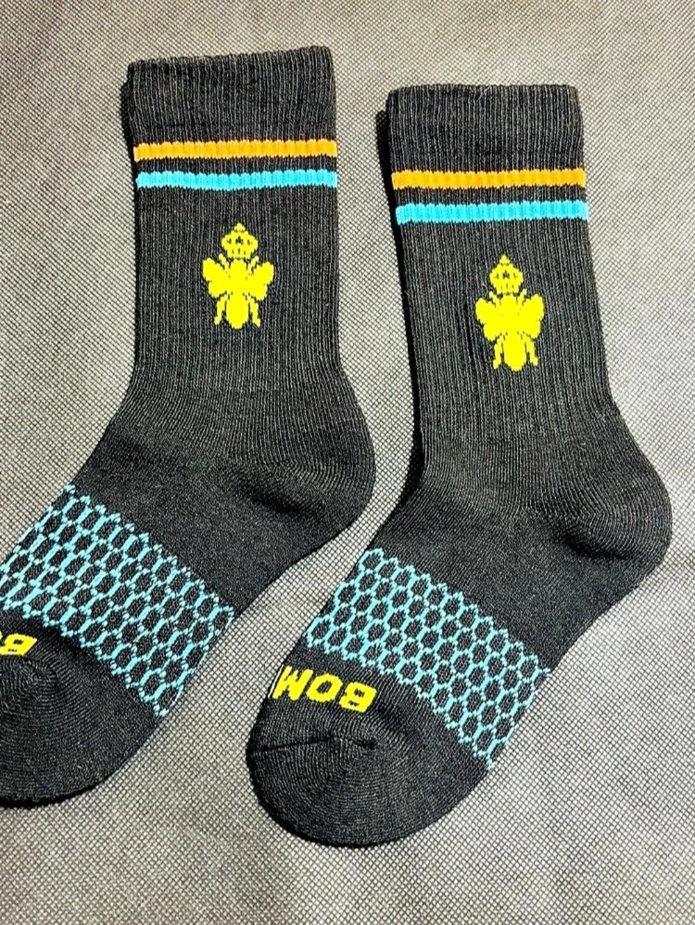 Bomba Kids “Bee Better” Calf Socks Size XS
Black/Yellow/Teal/Oran